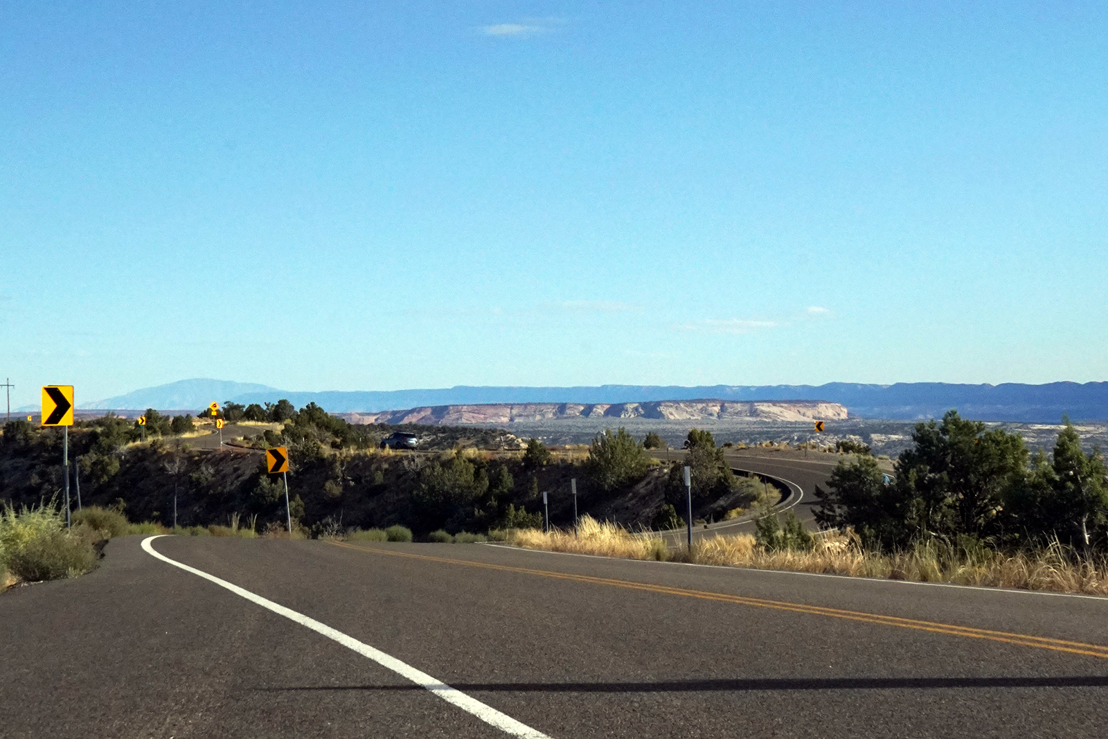 Utah State Road 12 winds over a thin ridge of rock, with amazing views for miles in every direction
